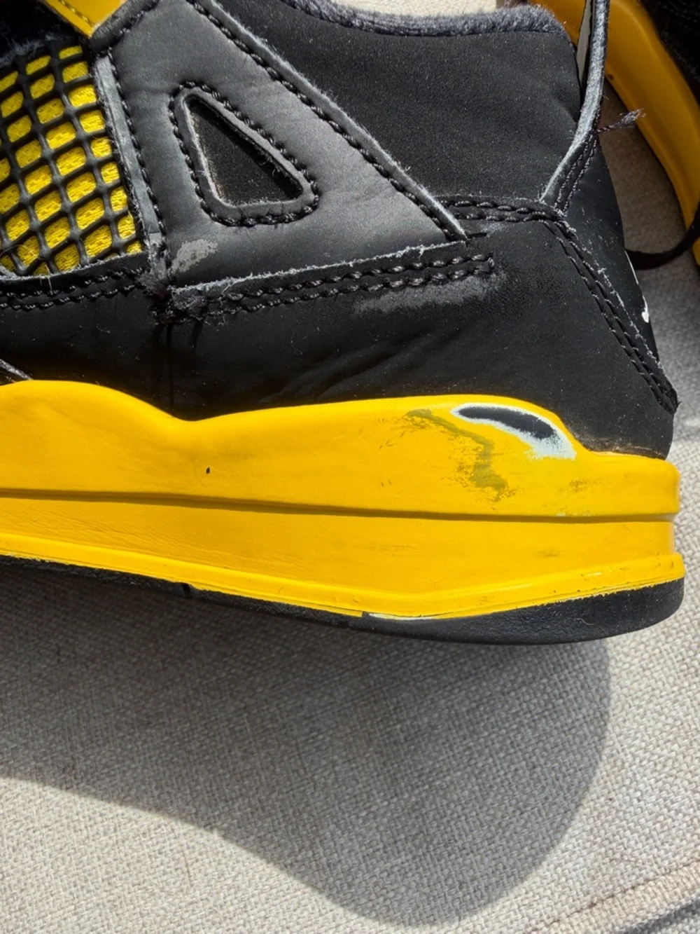 Air Jordan 4 Retro “Thunder” in size 2.5Y GUC.